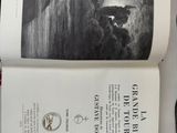 an open book with a picture of a man surfing on a wave