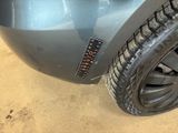 a close up of a car tire with a sticker on it