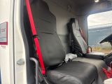 two seats in the back of a van with a red seat belt