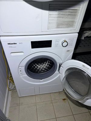 a washer and a dryer in a small room