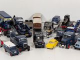 a lot of toy trucks that are sitting on a table