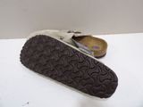 a close up of a pair of shoes on a table