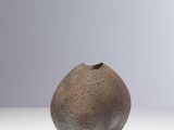 a small vase that is sitting on a table