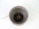 a silver cup with a small gold object inside of it