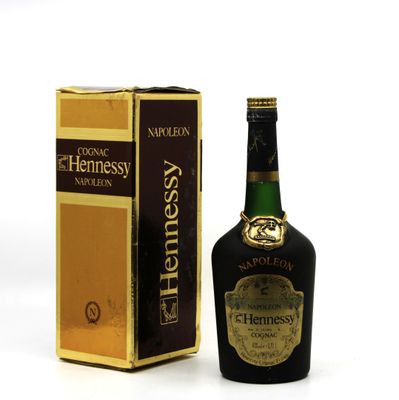 an image of a bottle of liquor next to a box