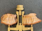 a pair of shoes that are sitting on a pair of legs