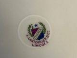 an image of a close up of a plate with a crest on it