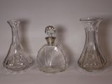 three glass vases sitting next to each other on a table