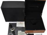 a close up of a box with a watch inside of it