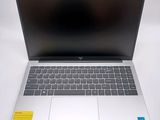 an open laptop computer sitting on top of a white table