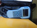 a cell phone sitting in a case on a table