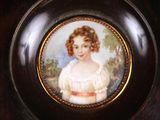 a picture of a miniature portrait of a young girl