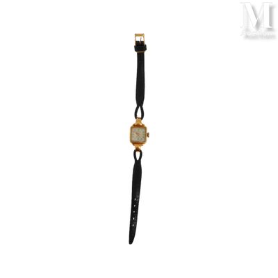 une image d'une montre-bracelet avec un bracelet noir et un cadran doré