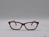 une paire de lunettes posée sur une surface blanche