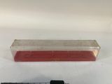 a plastic container with a red liquid inside of it