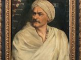 a painting of a man with a turban in a gold frame