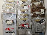 a lot of men ' s shirts on display in the store
