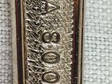 a close up of a silver spoon on a white cloth