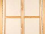 a close up of a picture of a window with a wooden frame