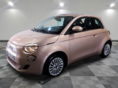 an image of a pink smart car in a showroom