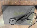 a laptop with a charger and a cord attached to it