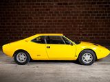 an image of a yellow sports car parked in a parking lot