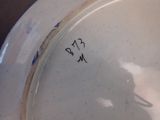 a close up of a plate with a bird on it