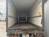 a truck that is sitting in the back of a truck