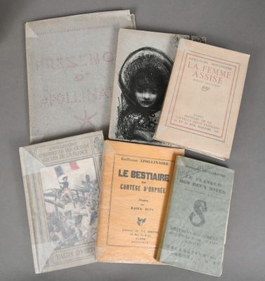 several books are stacked on top of each other on a table