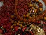 a pile of beads and other items on a table