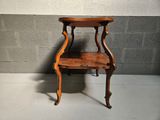 a small wooden table with a shelf on top of it