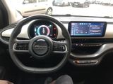 the interior of a car with a steering wheel, dashboard, and display screen