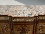 a marble top cabinet with drawers and drawers on it