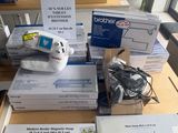 many boxes of electronic equipment sitting on a table