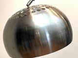 a metal lamp that is hanging from the ceiling