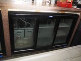 two refrigerators that are sitting on a counter