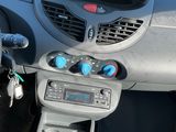 a car dashboard with a digital clock on it
