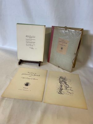 three books are sitting on a table with a white cloth