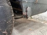 a close up of a car tire with a hole in the tire