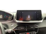 the dashboard of a car with a tablet on the dashboard