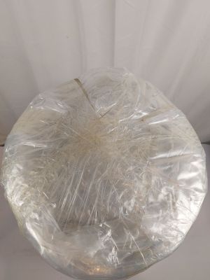 a plastic bag wrapped around a glass vase on a table