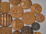 a lot of coins that are laying on a table