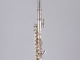 a flute that is sitting on top of a glass table