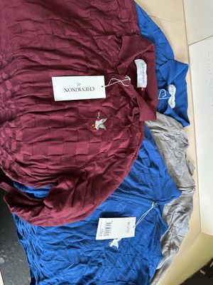 a blue and red sleeping bag with a tag on it