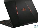 a laptop with a red and black logo on the screen