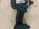 the cordless drill is sitting on the floor in the room