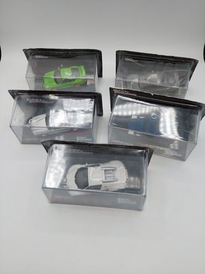 six plastic boxes with a toy car inside of them