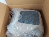 a cardboard box with a computer inside of it