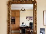 a mirror hanging on the wall in a living room
