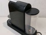 an image of a black coffee maker on a table